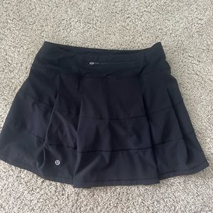 Lululemon Pace Rival Mid-Rise Skirt *Long in the color black. Size 4.